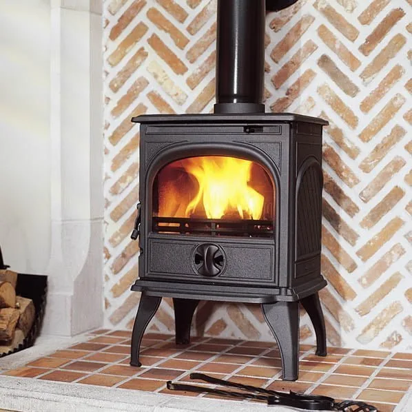 Dovre 250 freestanding stove in a brick fireplace setting