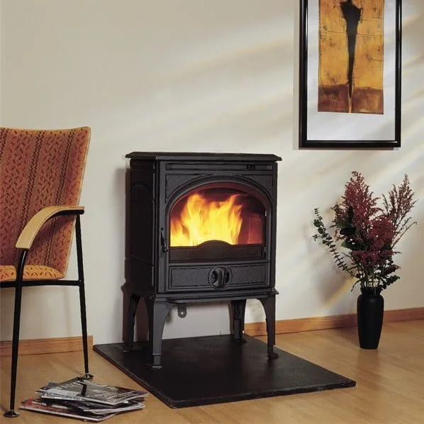 Dovre 425 freestanding cast-iron stove in a living room
